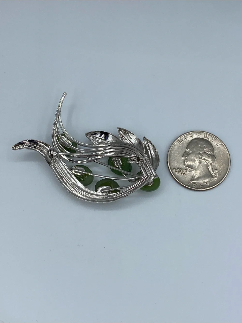 Silver-Tone Brooch with Glossy Green Cabochons